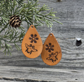 Hand-stamped leather earrings with honey bee and flower design, sterling silver ear wires, handmade by Cherokee Rose Custom Leather in East Texas.