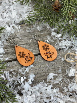 Hand-stamped leather earrings with honey bee and flower design, sterling silver ear wires, handmade by Cherokee Rose Custom Leather in East Texas.