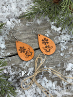 Hand-stamped leather earrings with honey bee and flower design, sterling silver ear wires, handmade by Cherokee Rose Custom Leather in East Texas.