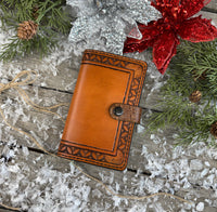 Stamped border Western leather memo pad holder with crocodile-embossed accents and black snap closure, handmade by Cherokee Rose Custom Leather.