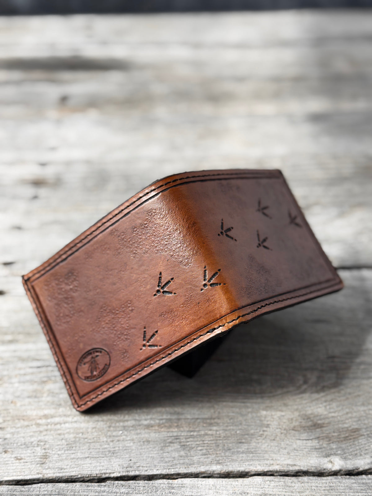 Turkey Track Stamped Leather Bifold Wallet