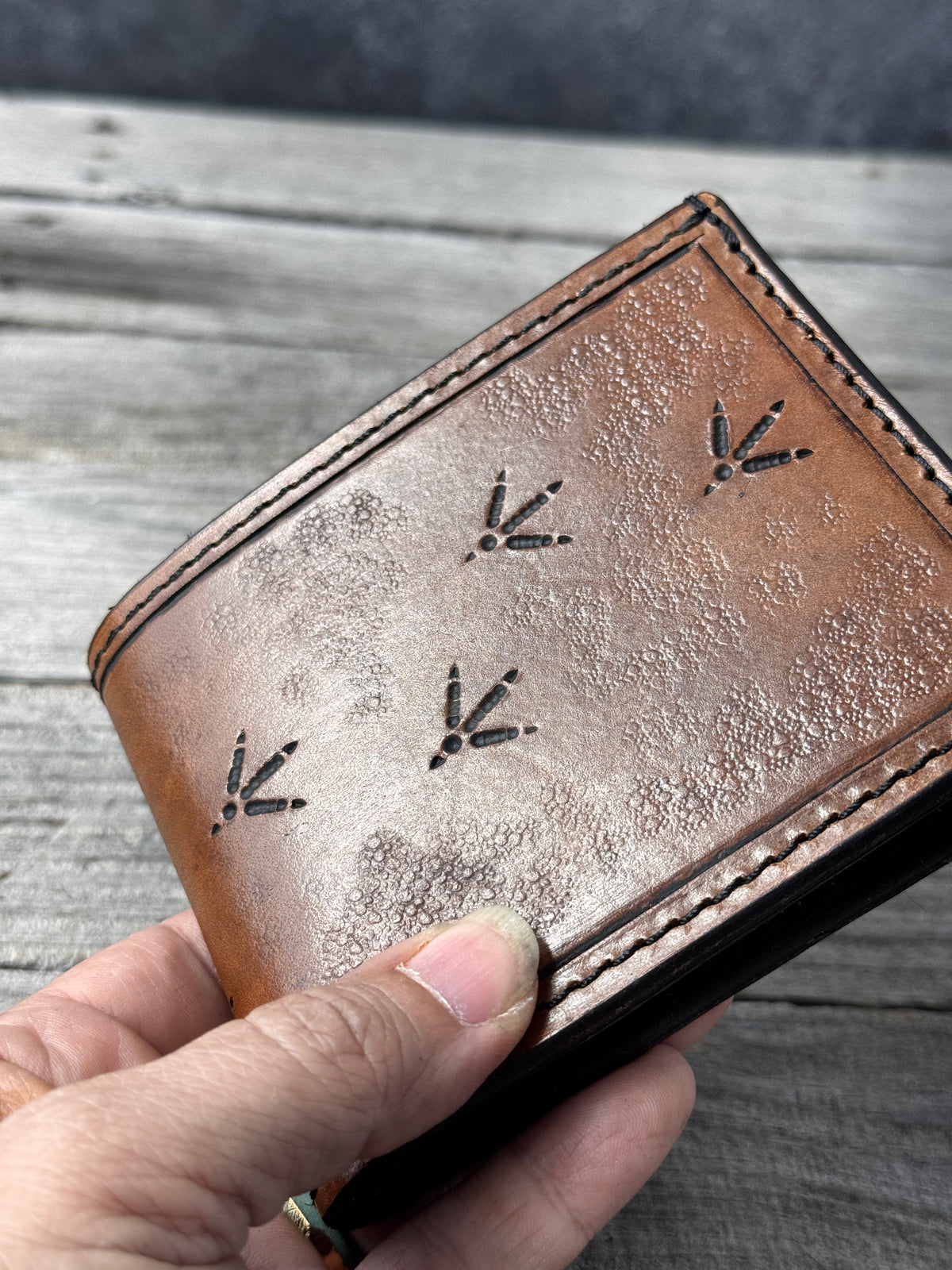 Turkey Track Stamped Leather Bifold Wallet