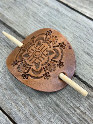 Intricately hand stamped Zia Sun leather hair barrette with bamboo hair stick.