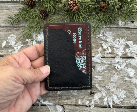 Two-tone handmade leather card wallet in reddish oil-tanned and black pigskin leather, stitched with brown waxed thread by Cherokee Rose Custom Leather.