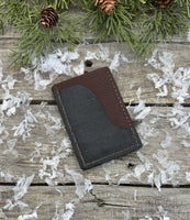 Two-tone handmade leather card wallet in reddish oil-tanned and black pigskin leather, stitched with brown waxed thread by Cherokee Rose Custom Leather.