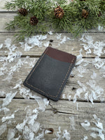 Two-tone handmade leather card wallet in reddish oil-tanned and black pigskin leather, stitched with brown waxed thread by Cherokee Rose Custom Leather.