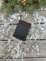 Two-tone handmade leather card wallet in reddish oil-tanned and black pigskin leather, stitched with brown waxed thread by Cherokee Rose Custom Leather.