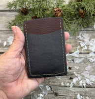 Two-tone handmade leather card wallet in reddish oil-tanned and black pigskin leather, stitched with brown waxed thread by Cherokee Rose Custom Leather.